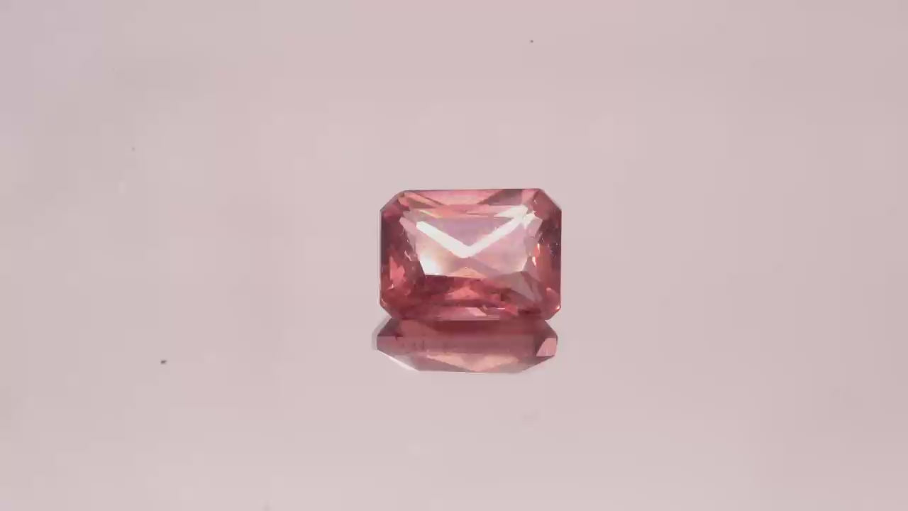 Natural Red Apatite 2.01 carats, emerald cut, light orangy red gemstone, untreated