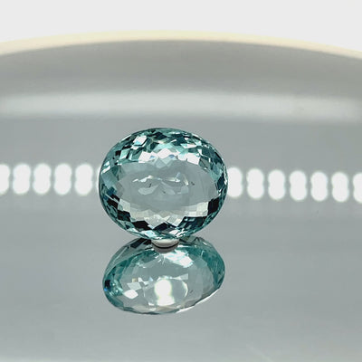 Natural aquamarine, 14.68 carats, roundish oval cut, eye clean clarity, untreated, vivid blue