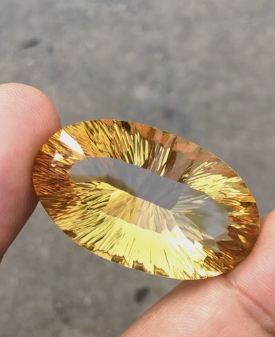 Natural citrine, 73.30 carats, oval cut, IF clarity, heated, slightly orange yellow, ČGL certified