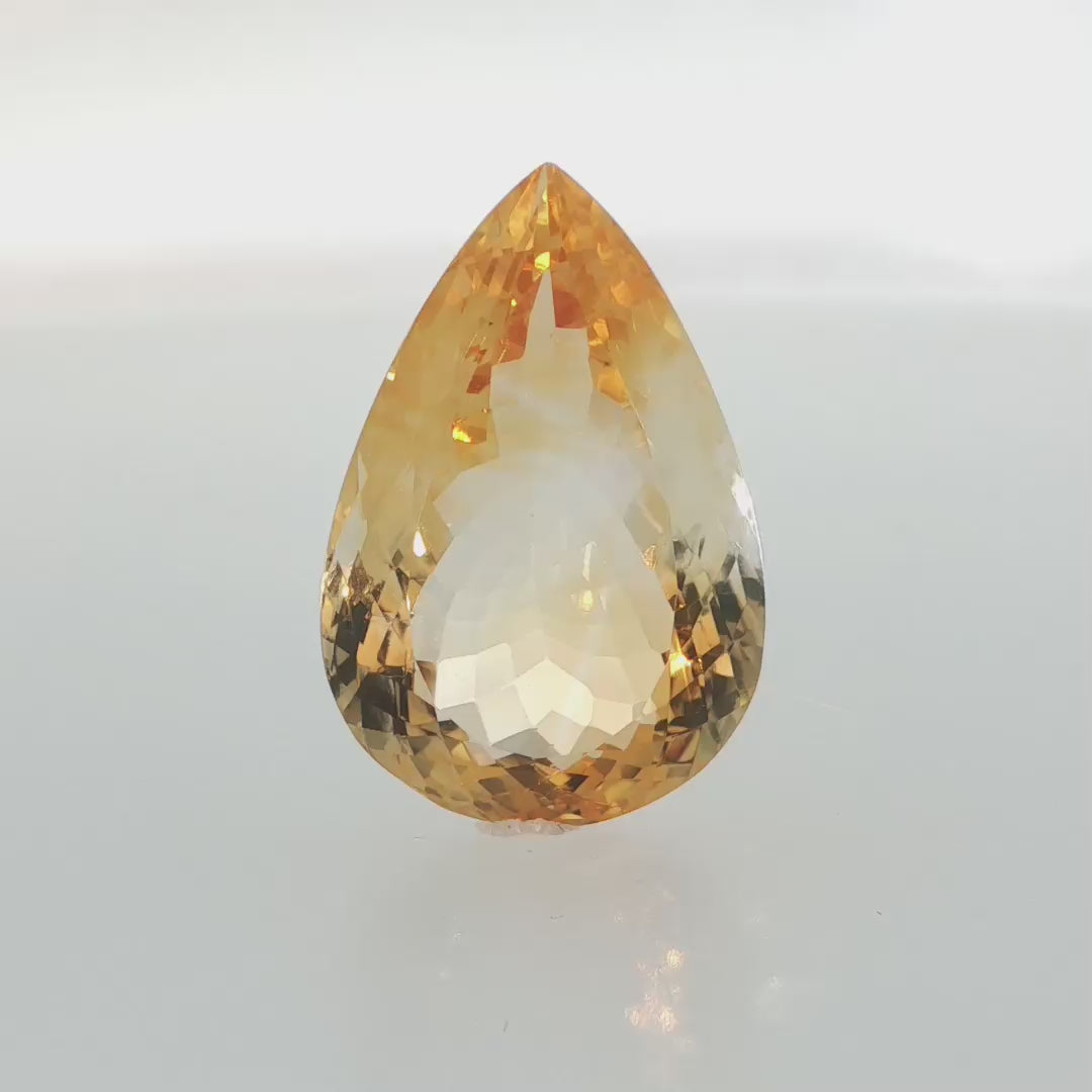 Natural citrine, 31.13 carats, pear cut, golden-yellow color, measuring 27.40 × 18.31 × 11.46 mm