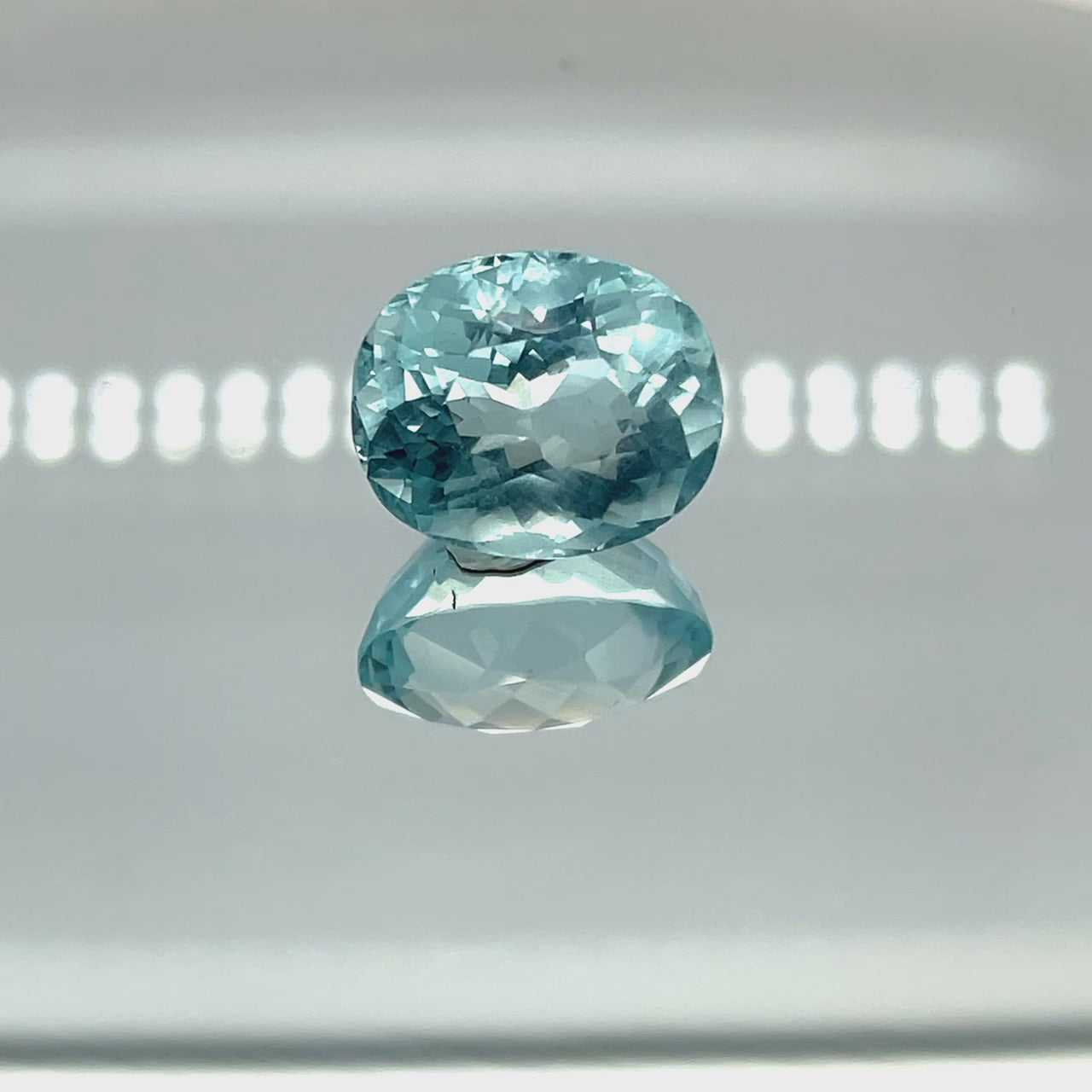 Natural aquamarine, 12.76 carats, oval cut, eye clean clarity, untreated, vivid blue