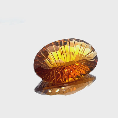 Natural honey citrine, 27.87 carats, oval honeycomb cut, IF clarity, untreated, honey orange color