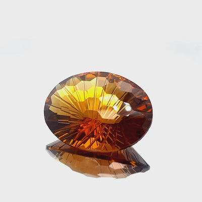 Natural honey citrine, 39.86 carats, oval honeycomb cut, IF clarity, untreated, honey orange color