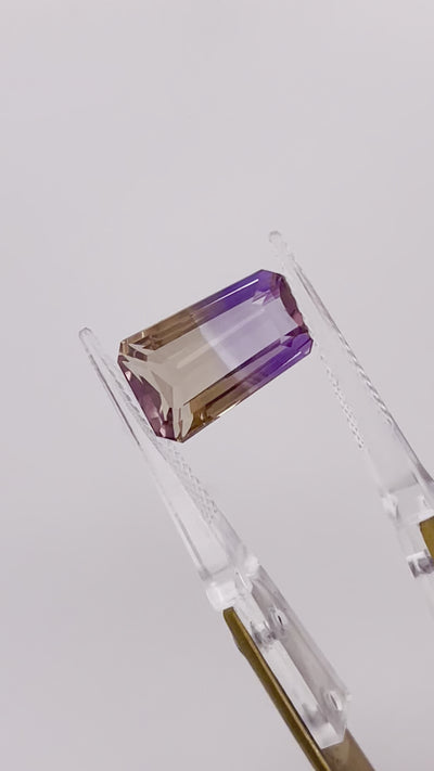Natural Ametrine 7.03 carats, tapered baguette cut, flawless purple-yellow bi-color gemstone, untreated