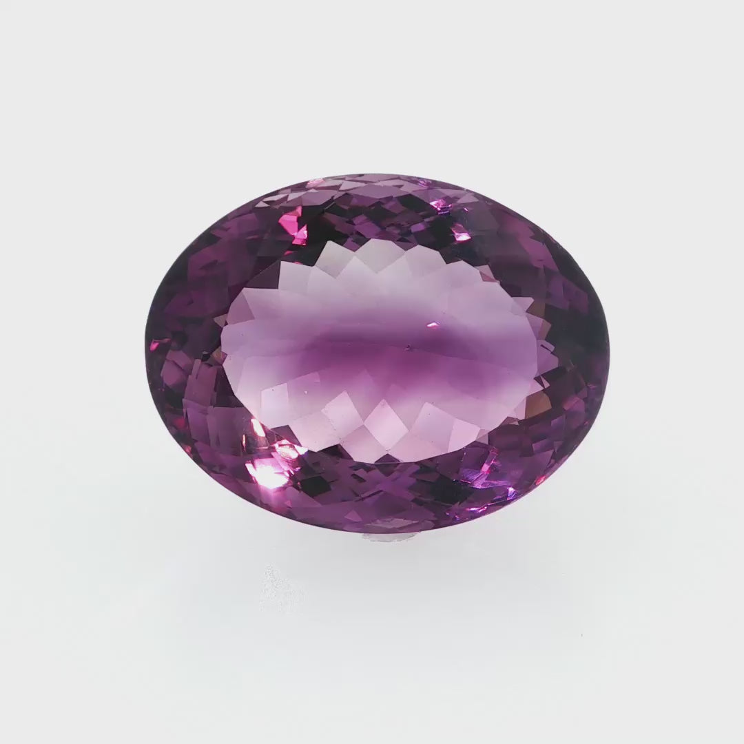 Natural amethyst, 53.78 carats, oval cut, clarity: eye clean, rich purple color, measuring 28.32 × 21.93 × 14.54 mm