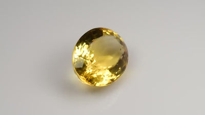 Natural citrine, 17.93 carats, oval cut, VVS clarity, heated, yellow / orange