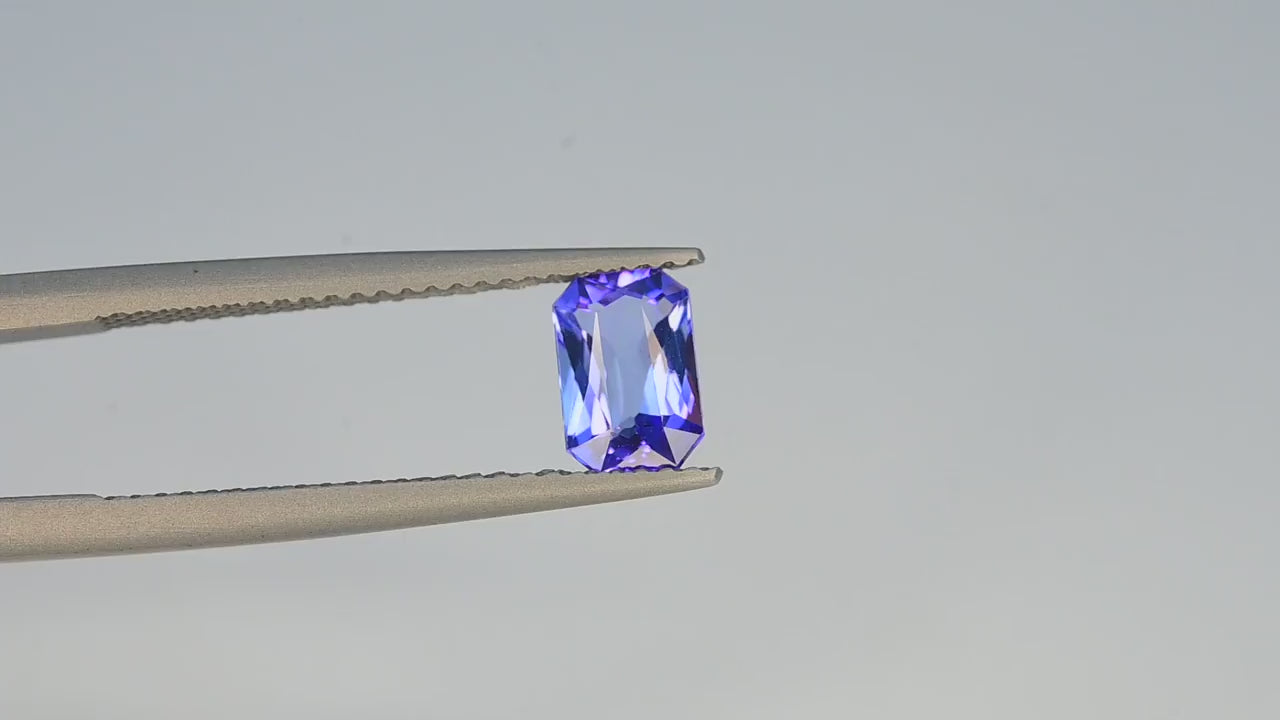 Natural tanzanite, 0.90 carats, emerald cut, eye clean clarity, heated, vivid blue