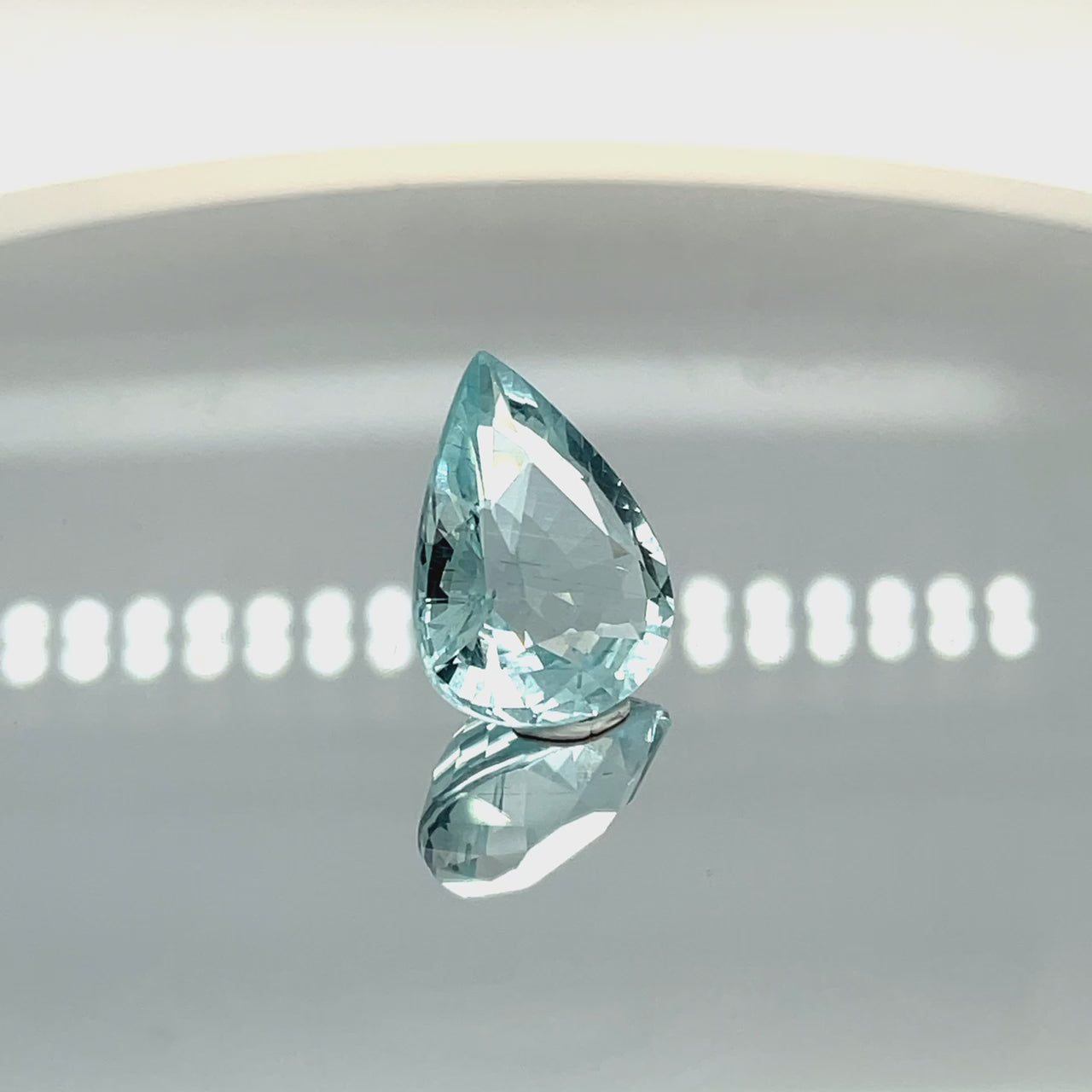 Natural aquamarine, 9.77 carats, pear cut, eye clean clarity, untreated, vivid blue