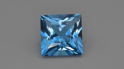 Natural Swiss Blue topaz, 21.79 carats, square cut, eye clean clarity, irradiated, vivid blue, ČGL certified, Brazil