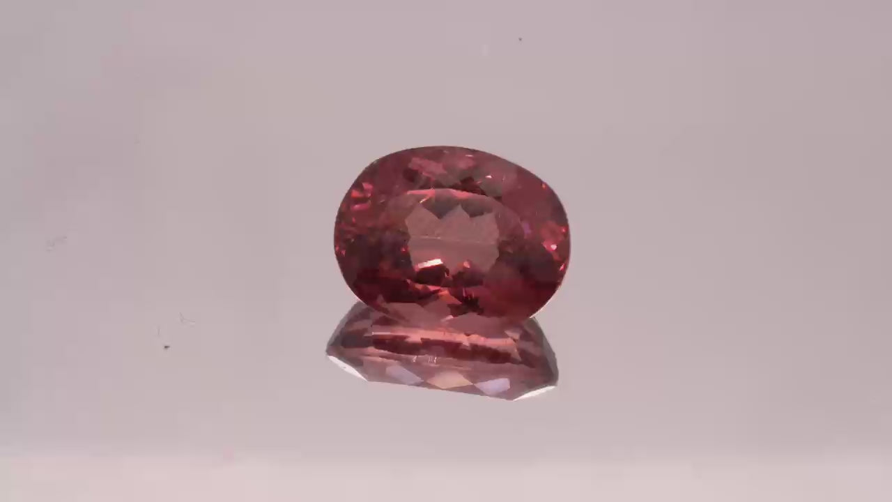 Natural Red Apatite 3.95 carats, oval cut, light orangy red gemstone, untreated