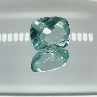 Natural aquamarine, 21.45 carats, cushion cut, slightly included clarity, untreated, vivid blue