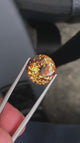 Natural topaz, 9.45 carats, fancy cut, VS clarity, heat treated, golden color