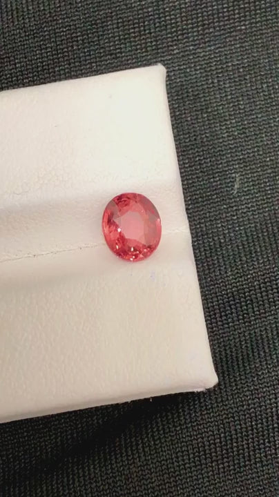 Natural Padparadscha sapphire, 1.56 carats, oval cut, pinkish-orange color, untreated, GRS certified