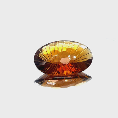 Natural honey citrine, 44.60 carats, oval honeycomb cut, IF clarity, untreated, honey-orange color