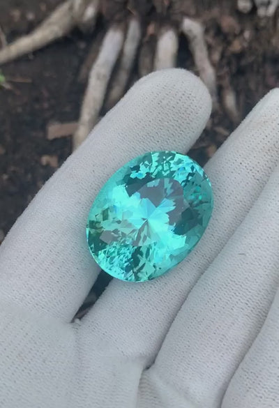 Natural Paraiba tourmaline, 85.34 carats, oval cut, GIA certified, vivid greenish-blue neon gemstone