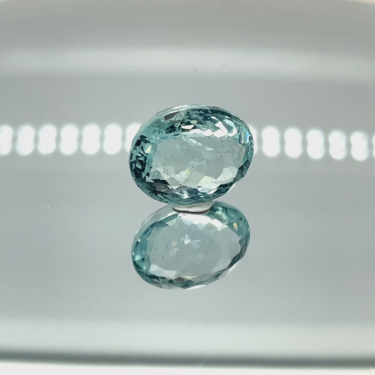 Natural aquamarine, 11.91 carats, oval cut, eye clean clarity, untreated, vivid blue