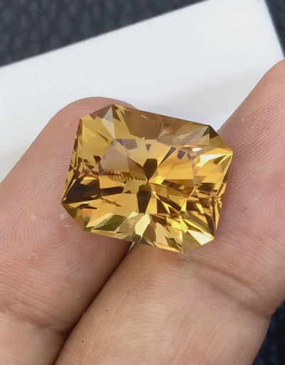 Natural citrine, 20.31 carats, fancy octagonal cut, VVS-IF clarity, heated, orangy yellow