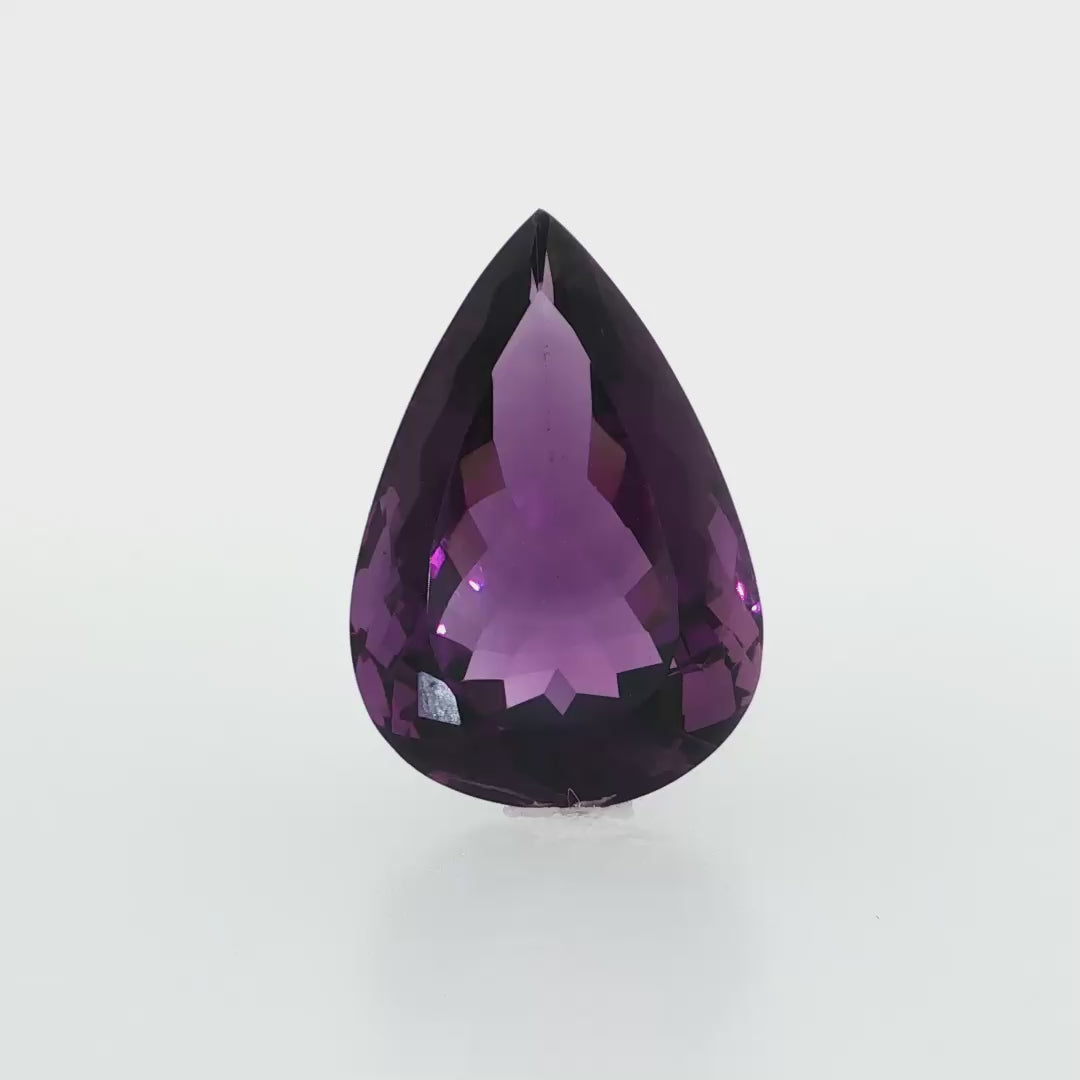 Natural amethyst, 26.49 carats, pear cut, clarity: eye clean, rich purple color, measuring 26.24 × 18.05 × 11.27 mm
