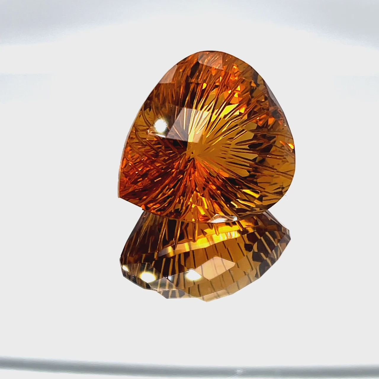 Natural honey citrine, 36.39 carats, pear honeycomb cut, IF clarity, untreated, honey-orange color