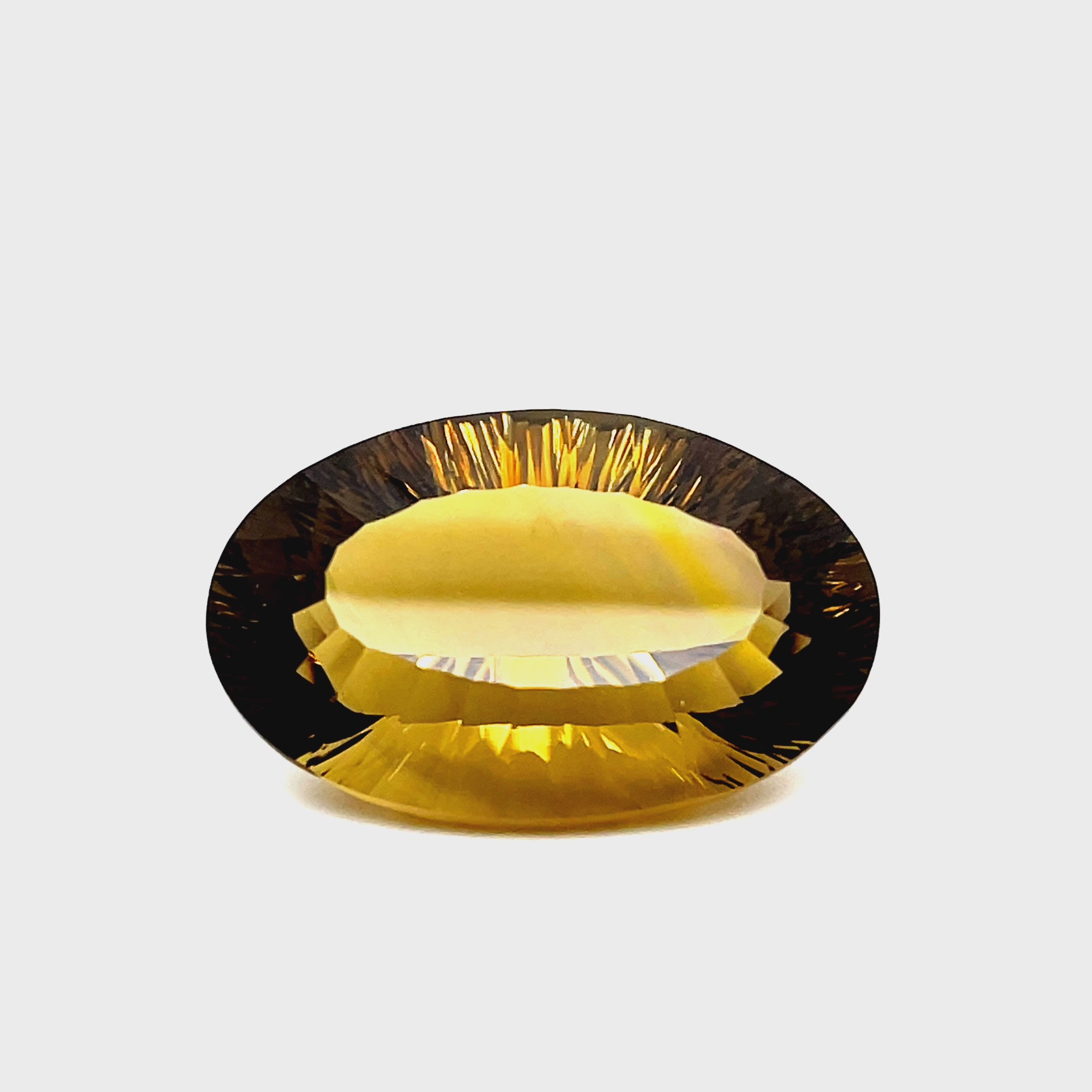 Natural citrine, 58.00 carats, fancy oval cut, IF clarity, brownish-yellow color, heated