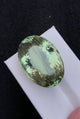 Natural prasiolite, 57.05 carats, oval faceted cut, heat treated, pastel green color
