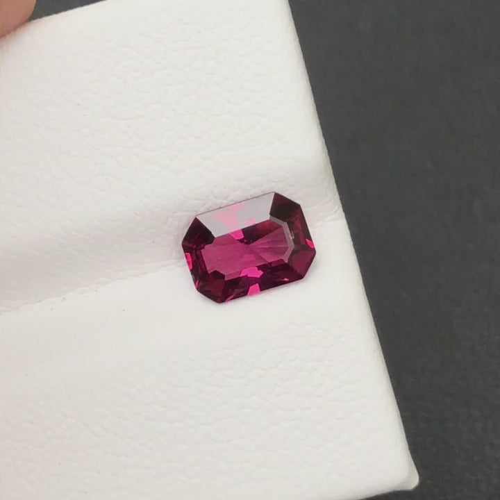 Natural rhodolite garnet, 1.25 carats, octagonal cut, VVS clarity, untreated, pinkish-red color