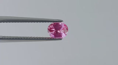 Natural Padparadscha sapphire, 0.95 carats, oval cut, untreated, eye clean, orangy-pink, Sri Lanka