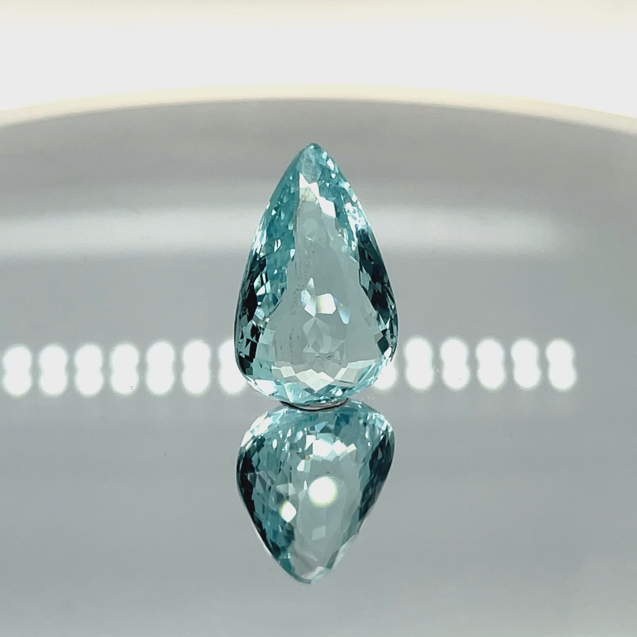 Natural aquamarine, 13.43 carats, pear cut, eye clean clarity, untreated, vivid blue