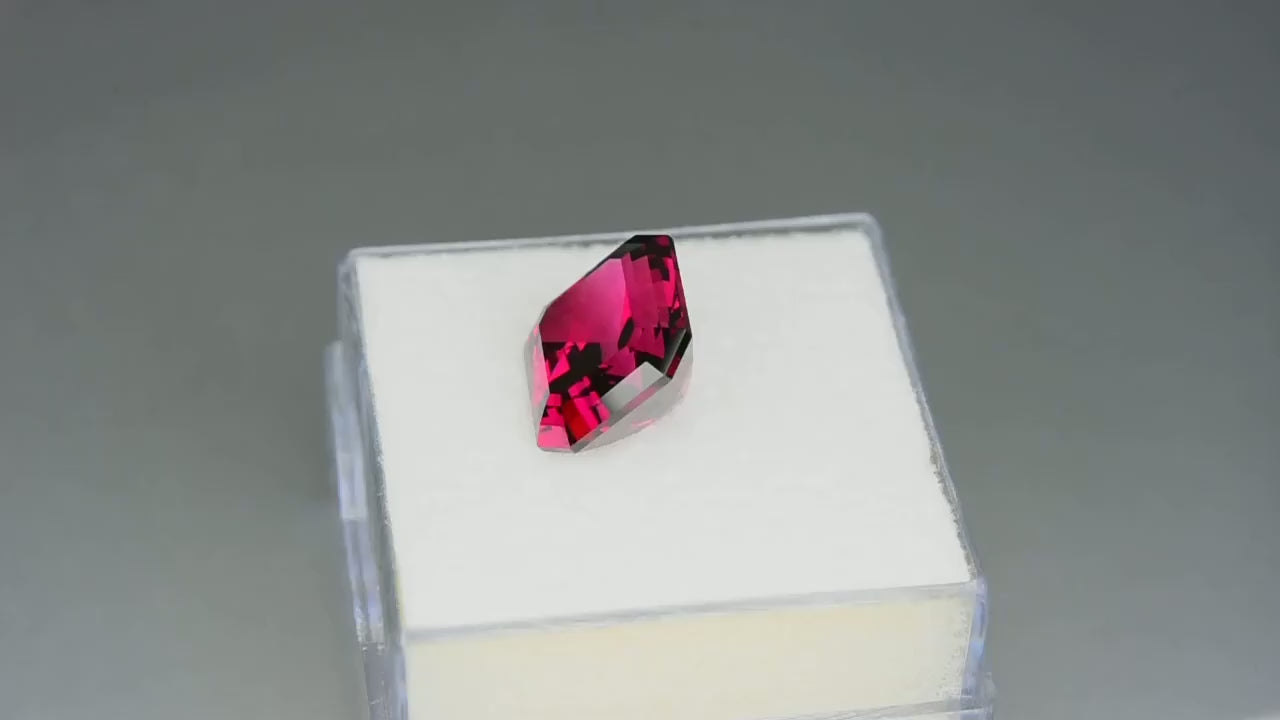 Natural Umbalite garnet, 5.12 carats, purplish-red color, radiant cut, loupe clean, untreated