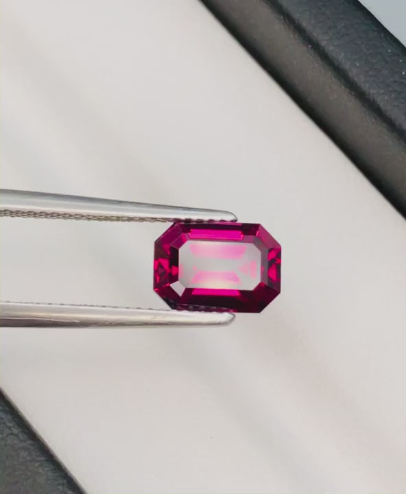 Natural rhodolite garnet, 2.80 carats, octagonal cut, VS clarity, untreated, pinkish-red color