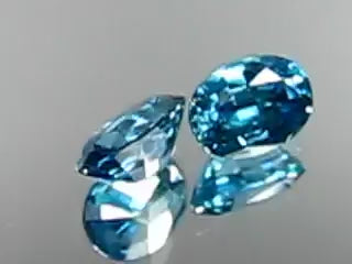 Natural blue zircon pair, 2.62 carats total, oval cut, VVS/VS clarity, heated