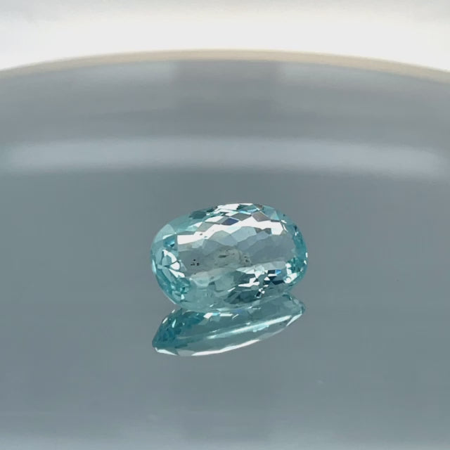 Natural aquamarine, 11.06 carats, oval cut, eye clean clarity, untreated, vivid blue