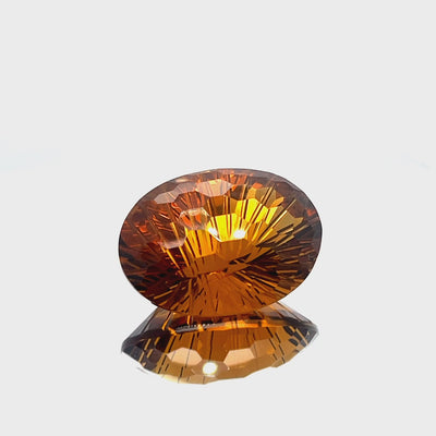 Natural honey citrine, 51.78 carats, oval honeycomb cut, IF clarity, untreated, honey-orange color