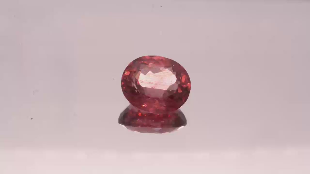 Natural Red Apatite 3.96 carats, oval cut, light orangy red gemstone, untreated