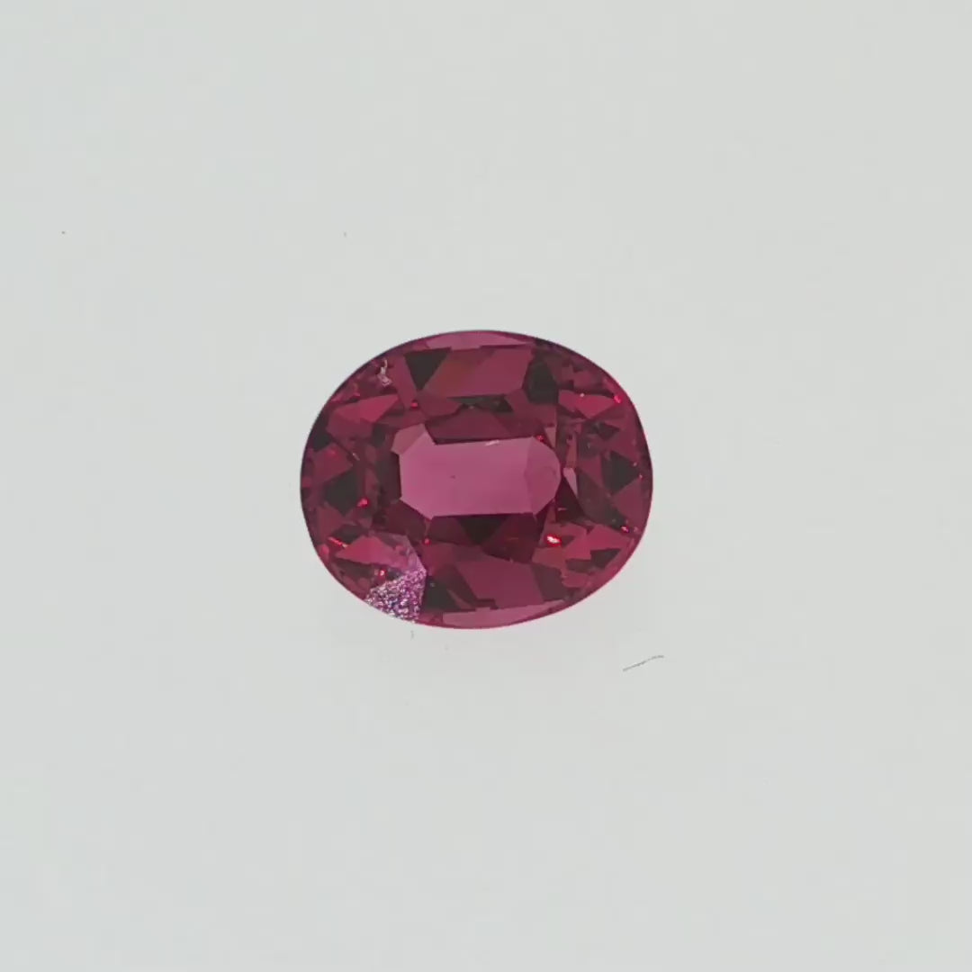Natural pyrope-almandine garnet, 1.05 carats, oval cut, slightly orangy red color, transparent, ČGL certified gemstone