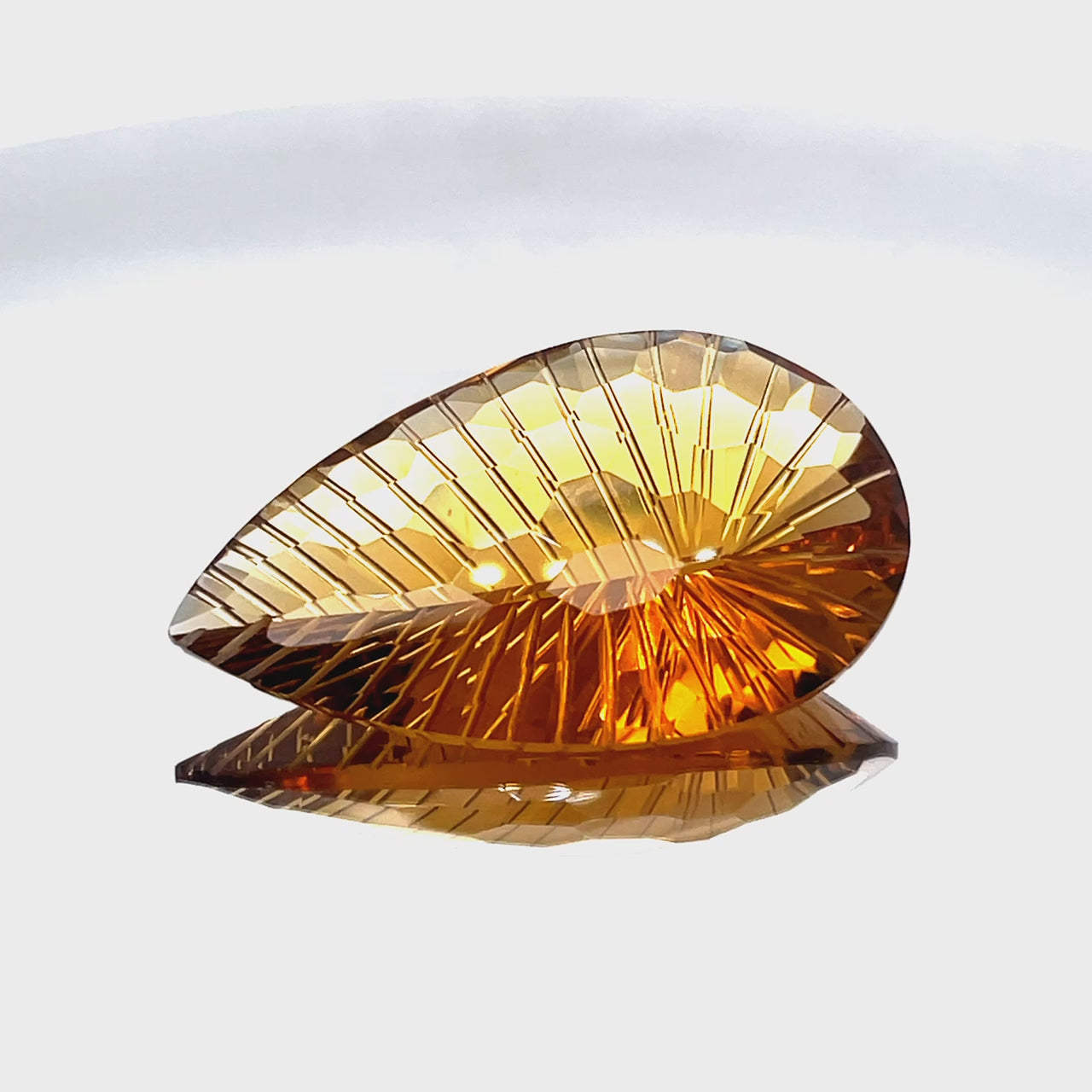Natural honey citrine, 44.00 carats, pear honeycomb cut, IF clarity, untreated, honey-orange color