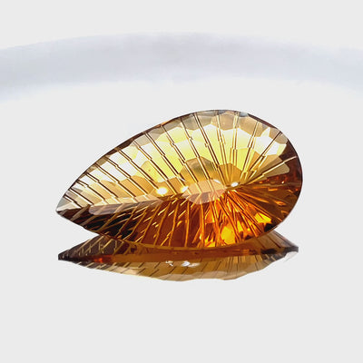 Natural honey citrine, 44.00 carats, pear honeycomb cut, IF clarity, untreated, honey-orange color