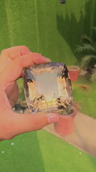 Natural rutilated quartz, 1308 carats, fancy faceted cut, VVS clarity, untreated, with golden rutile inclusions