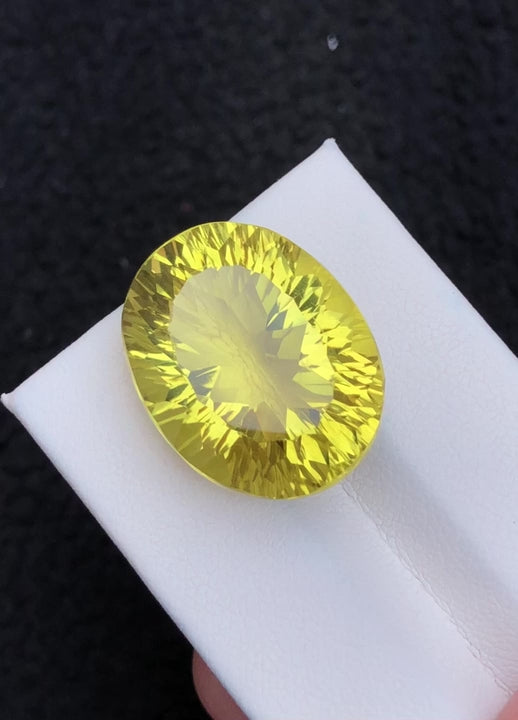 Natural lemon quartz, 28.15 carats, oval faceted cut, untreated, bright yellow color