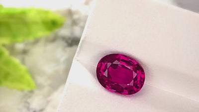 Top view of 4.78 ct natural ruby in purple-red color, oval brilliant/step cut, no heat, GIA certified