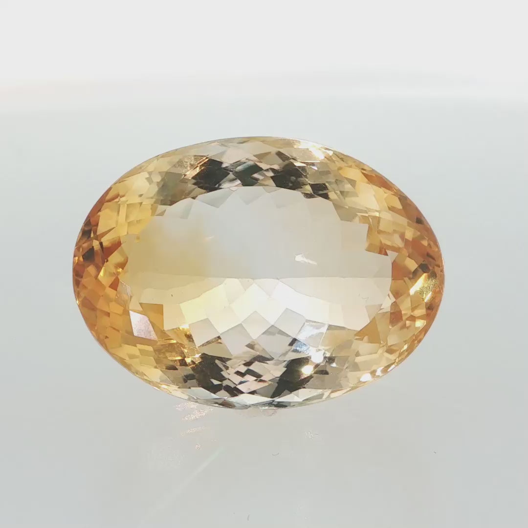 Natural citrine, 65.18 carats, oval cut, clarity: eye clean, golden-yellow color, measuring 31.05 × 22.87 × 14.97 mm