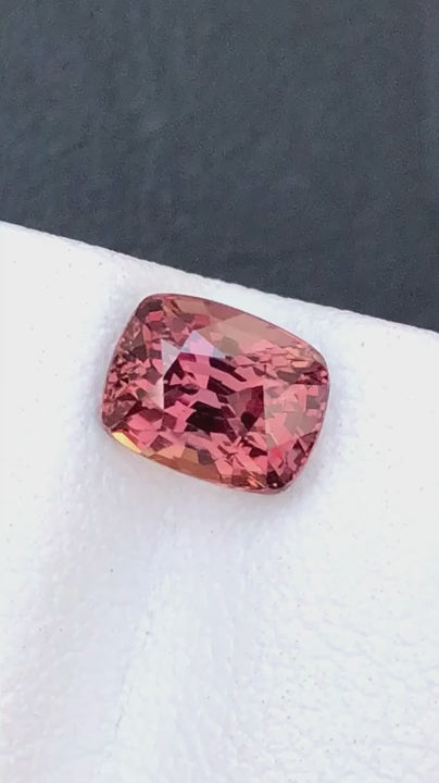 Natural Padparadscha sapphire, 1.55 carats, cushion cut, untreated, orange-pink color, AIG certified