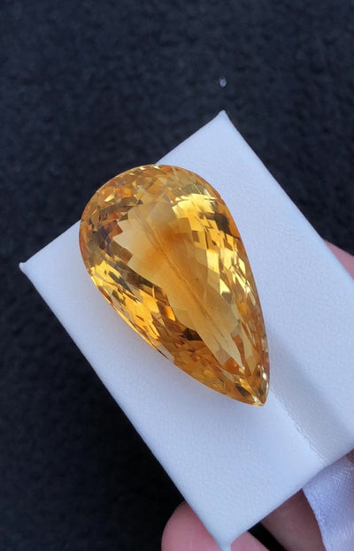 Natural citrine, 55.70 carats, pear faceted cut, untreated, golden-yellow color