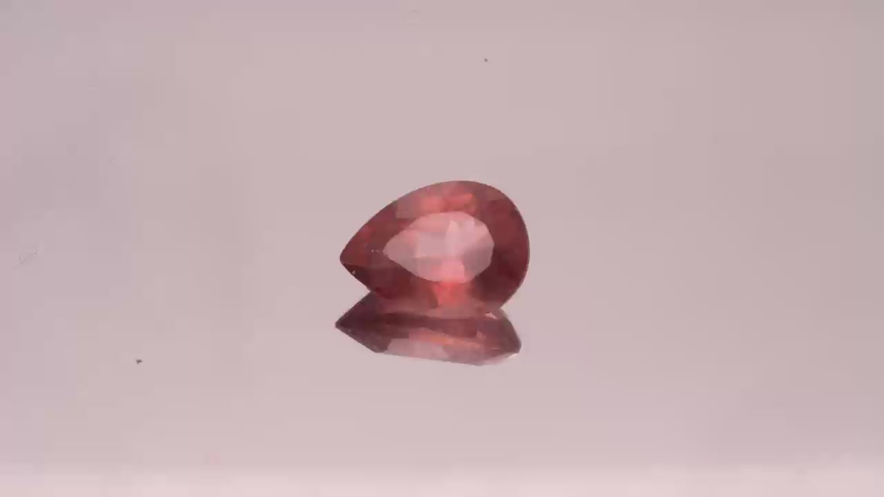 Natural Red Apatite 1.57 carats, pear cut, light orangy red gemstone, untreated