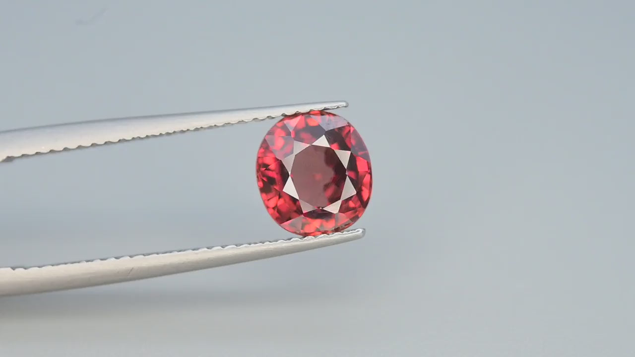 Natural red zircon, 2.50 carats, oval cut, VVS clarity, untreated, with warm undertones