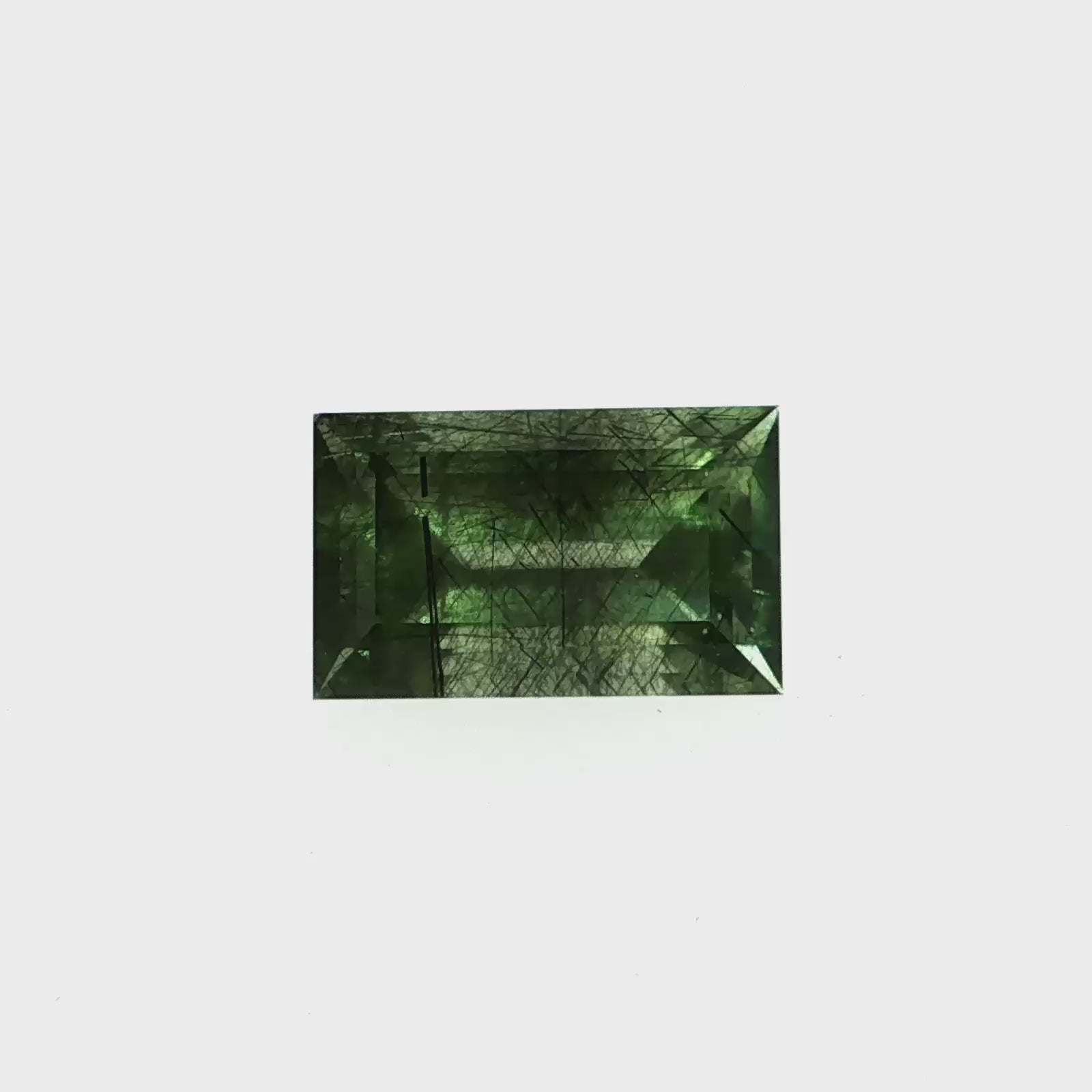 Natural ludwigite included peridot, 6.77 carats, baguette cut, green gemstone with black needle inclusions