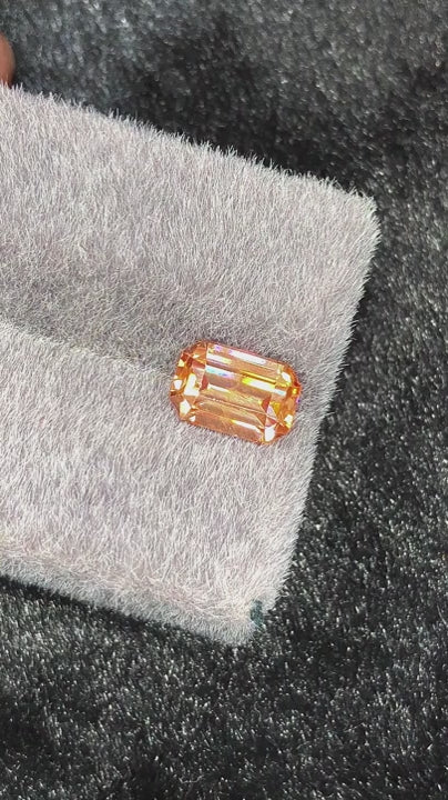 Natural zircon, 3.20 carats, emerald cut, VVS clarity, untreated, vivid orange-golden color