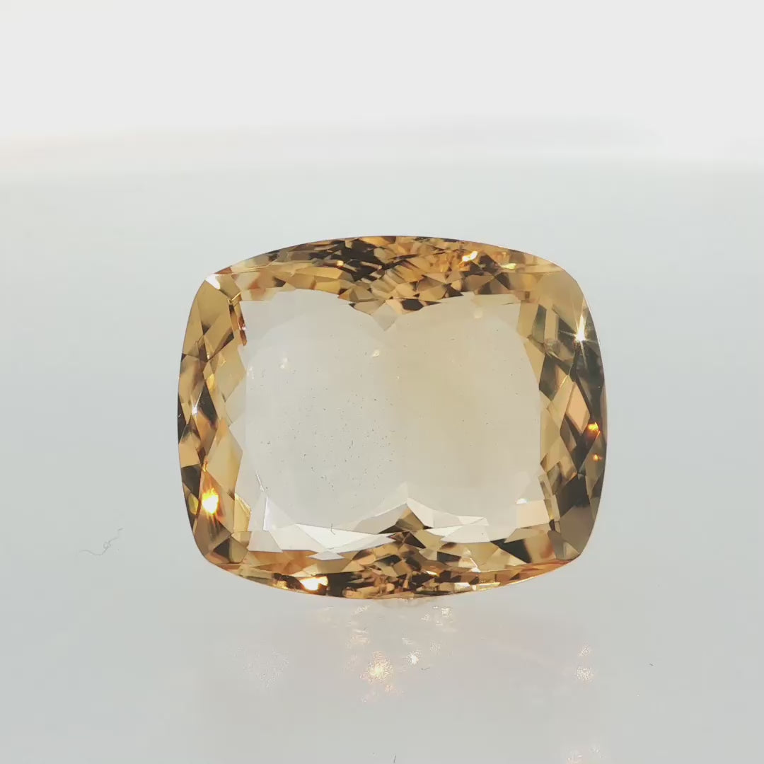 Natural citrine, 43.10 carats, cushion cut, clarity: eye clean, golden-yellow color, measuring 25.49 × 21.65 × 11.97 mm