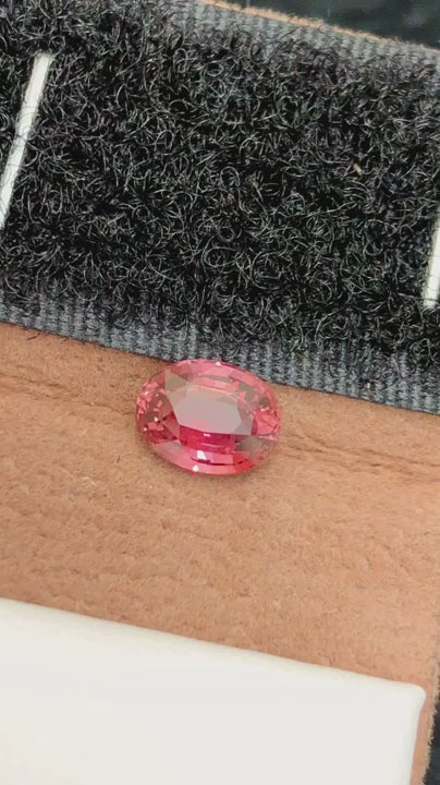 Natural Padparadscha sapphire, 1.51 carats, oval cut, untreated, orange-pink color, AIG certified