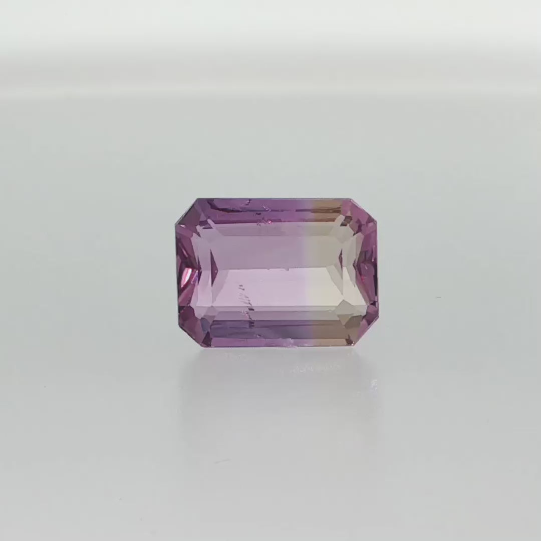 Natural untreated ametrine, 8.24 carats, emerald cut, clarity: slightly included, purple and golden yellow bi-color quartz, measuring 14.26 × 10.59 × 6.73 mm
